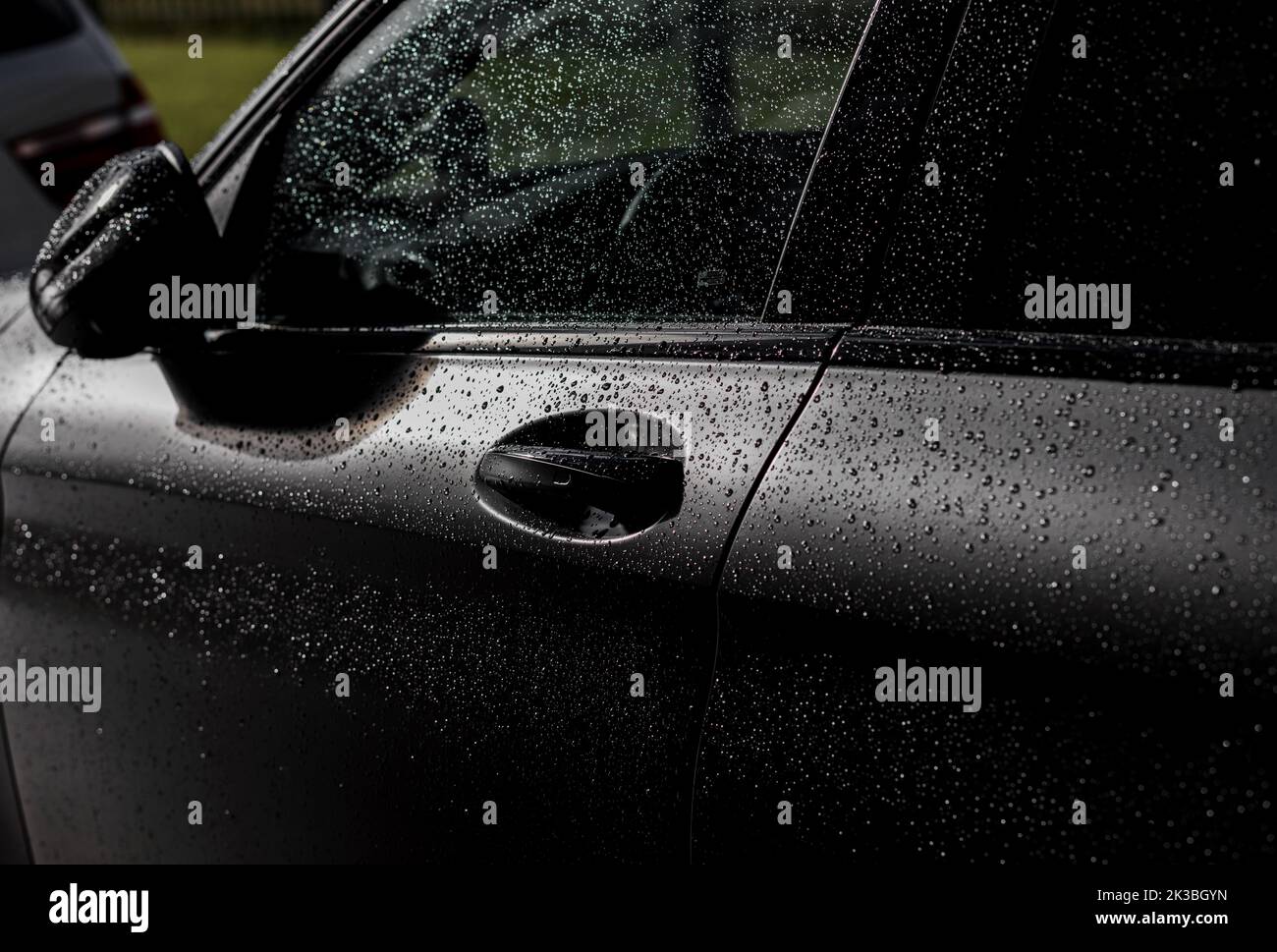 Water droplet on the car. Water beading after rain or car wash on shiny