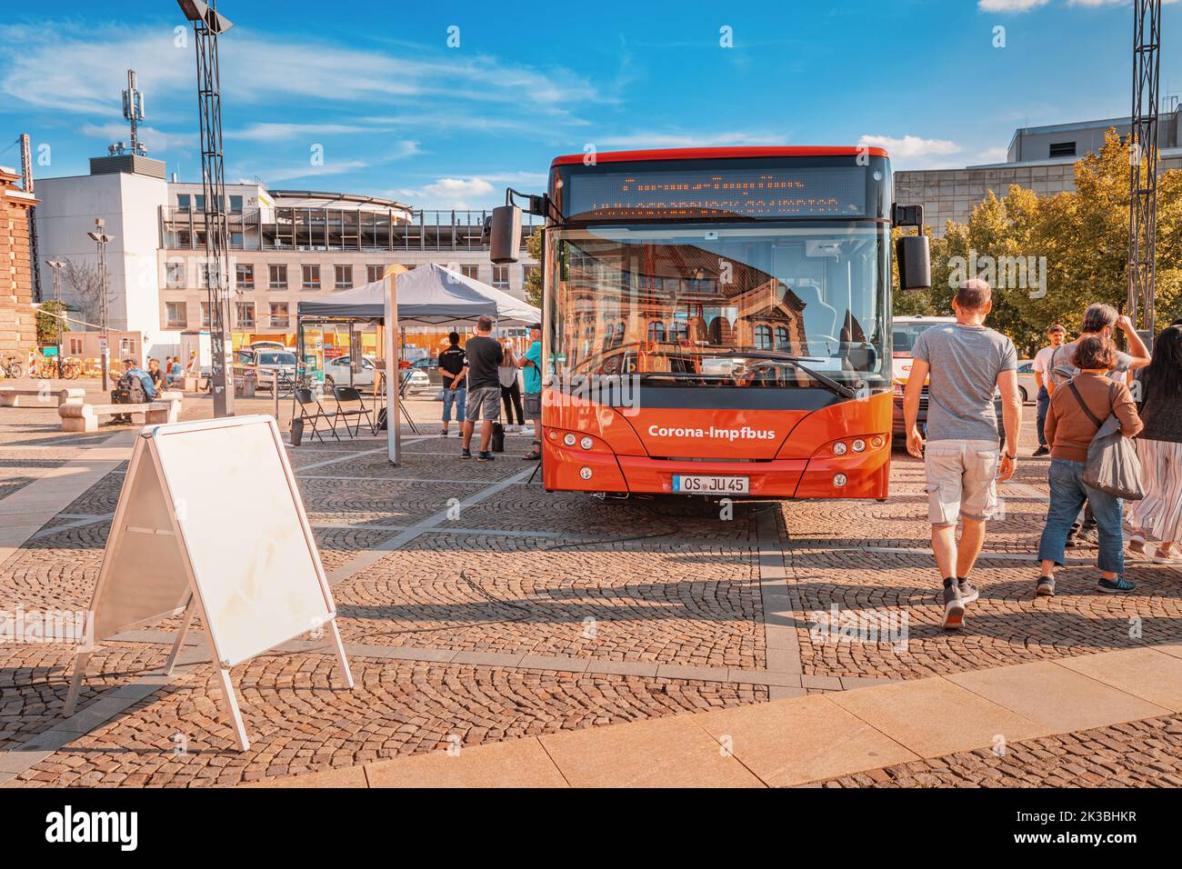 23 July 2022, Osnabruck, Germany: vaccination against covid-19 coronavirus on an Impfbus bus in a public square in the city. Epidemic safety and outbr Stock Photo