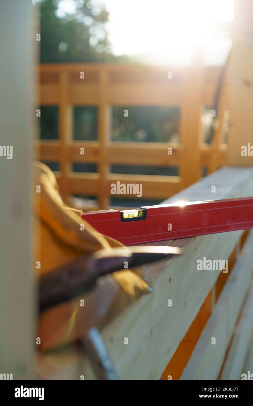 Close up of construction tools inside of unfinished wooden house. Stock Photo