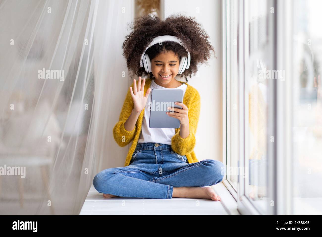 Happy african american child having online party with friends Stock ...
