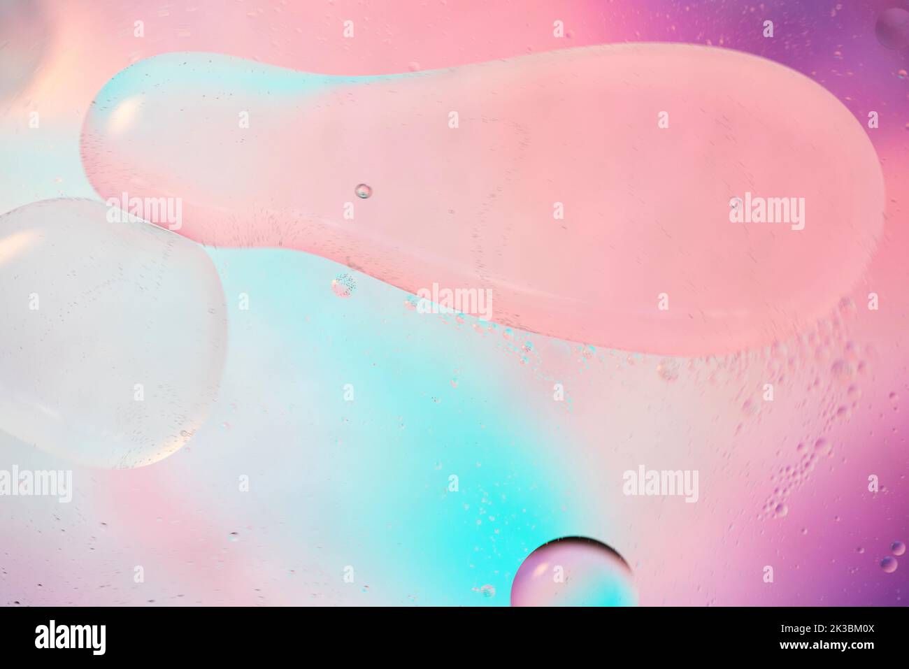 Defocused pastel colored abstract background picture made with oil, water and soap Stock Photo