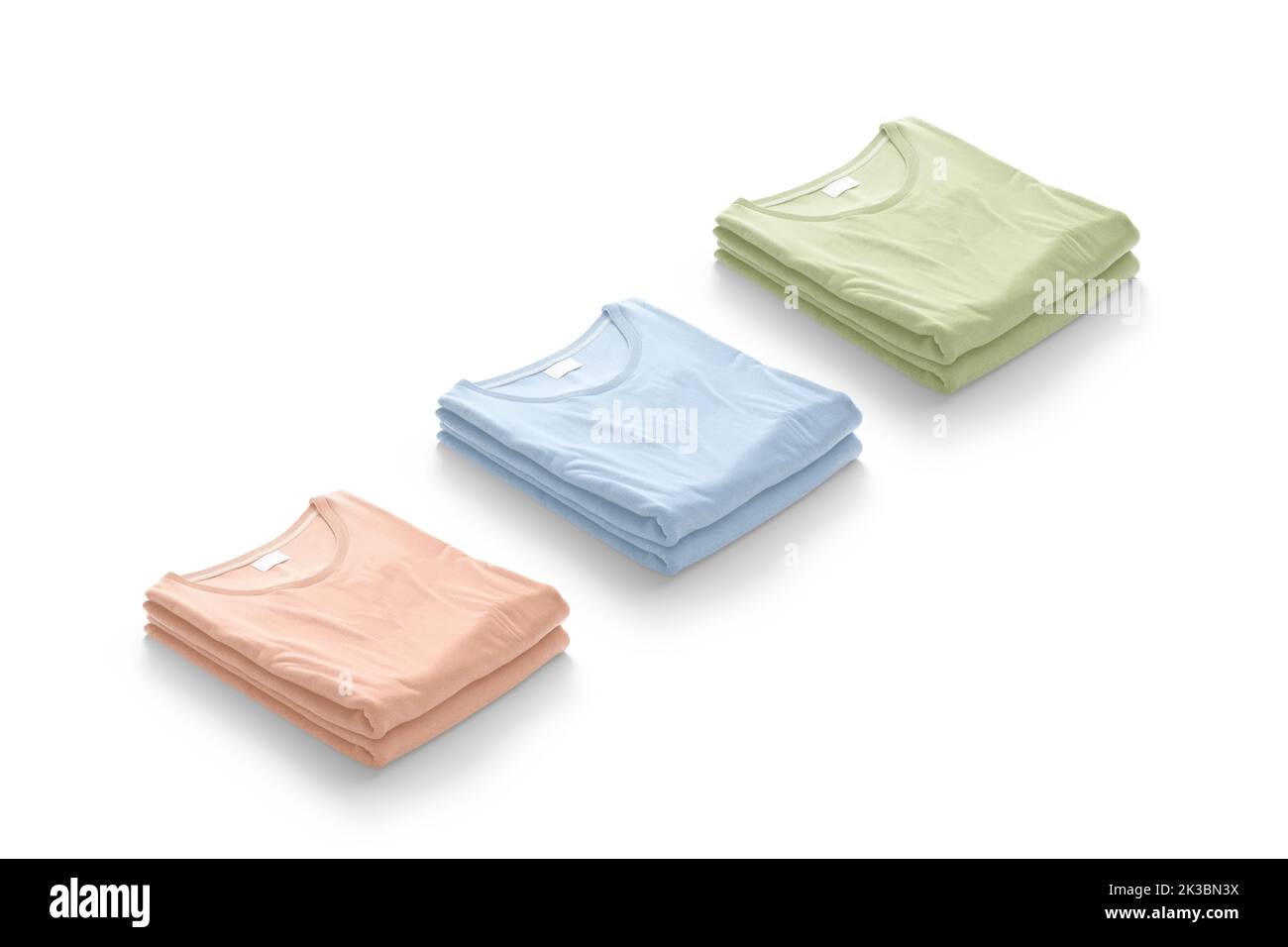 Blank colored folded square t-shirt mockup stack, side view, 3d rendering. Empty pink, blue and green crumpled tshirt mock up, isolated. Clear casual Stock Photo