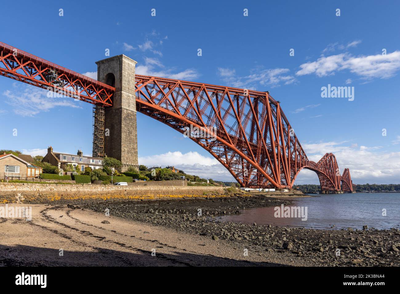 The mighty Forth rail bridge spreading across the Firth of Forth connecting north and south Queensferry in Scotland. Taken from North Queensferry. Stock Photo