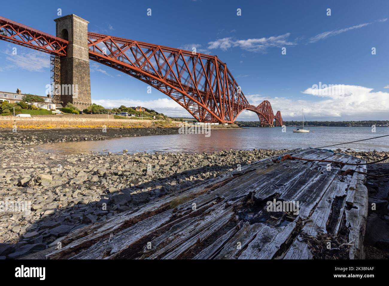 The mighty Forth rail bridge spreading across the Firth of Forth connecting north and south Queensferry in Scotland. Taken from North Queensferry. Stock Photo