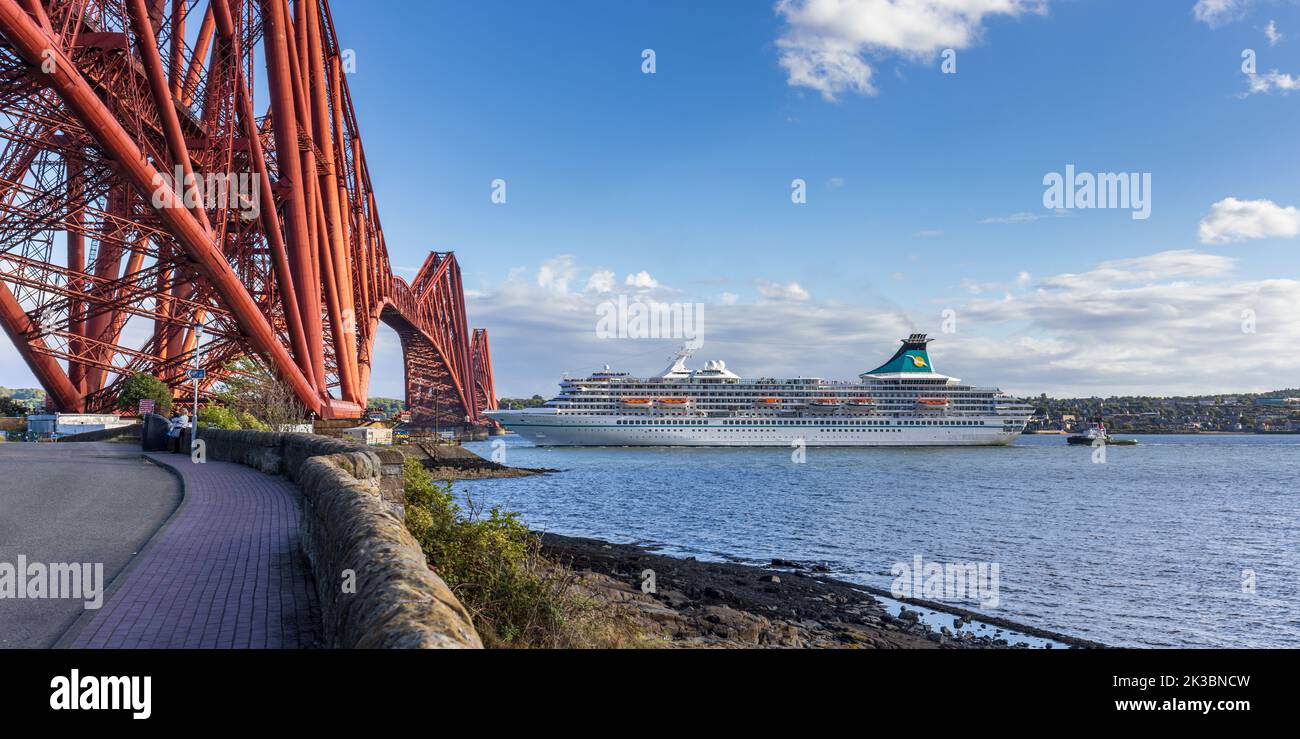German cruise ship MS Artania about to sail under the Forth Rail Bridge, taken from North Queensferry. Stock Photo