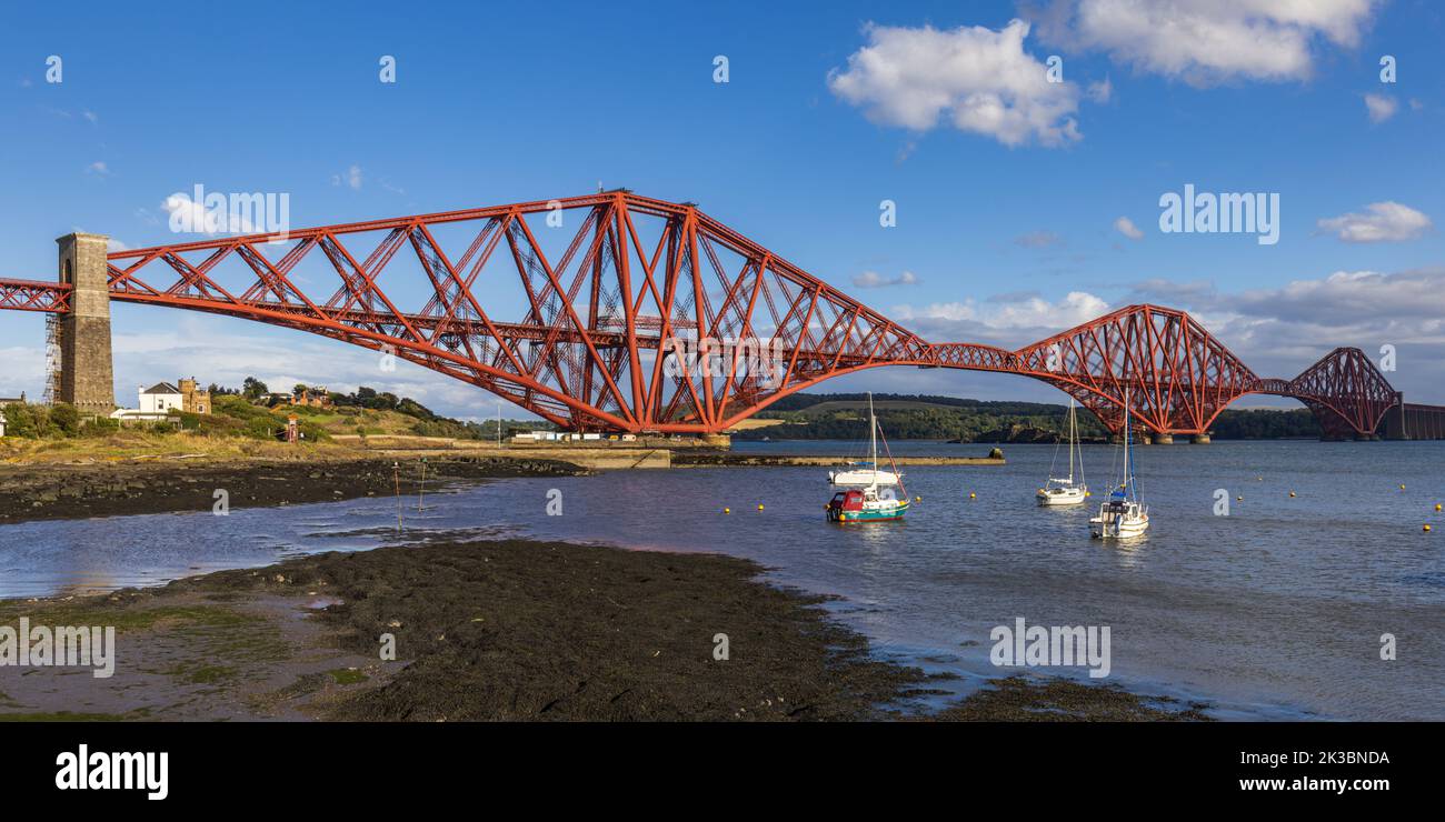 The mighty Forth rail bridge spreading across the Firth of Forth connecting north and south Queensferry. Taken from North Queensferry. Stock Photo