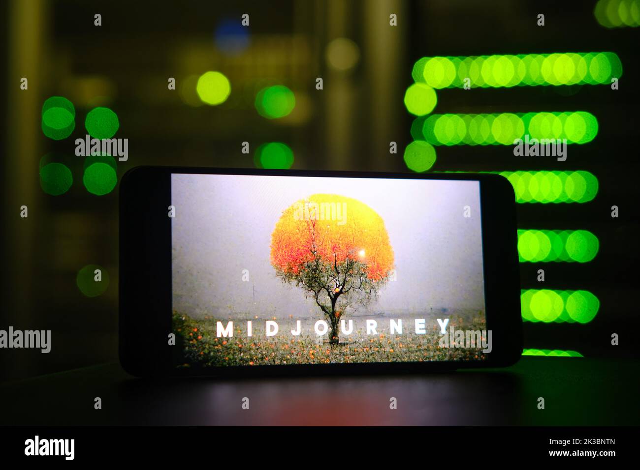 AI Midjourney logo on the phone screen on the background of the server room. Smartphone with artificial intelligence neural network logo - Moscow, Rus Stock Photo