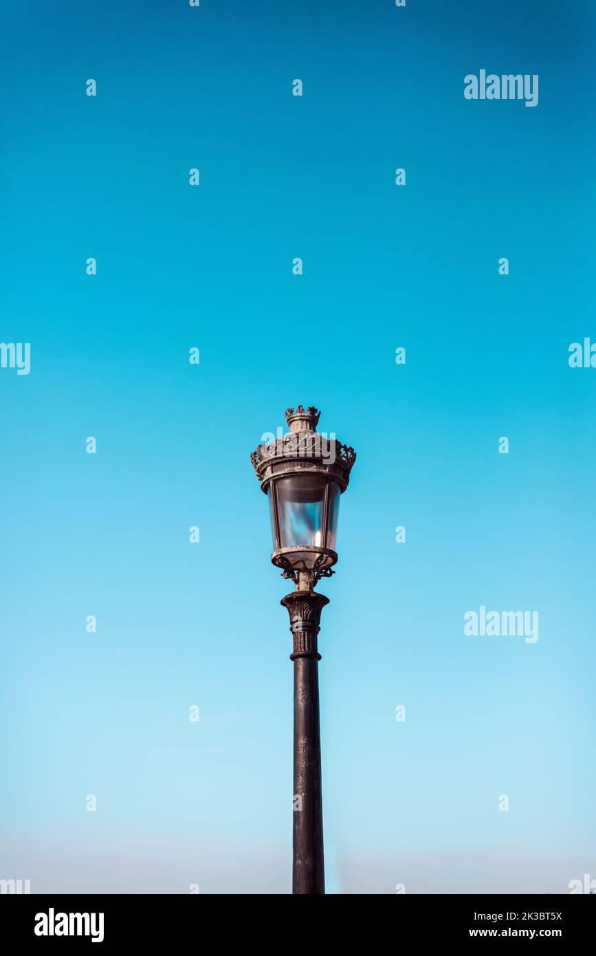 Victorian streetlight against plain sky Stock Photo