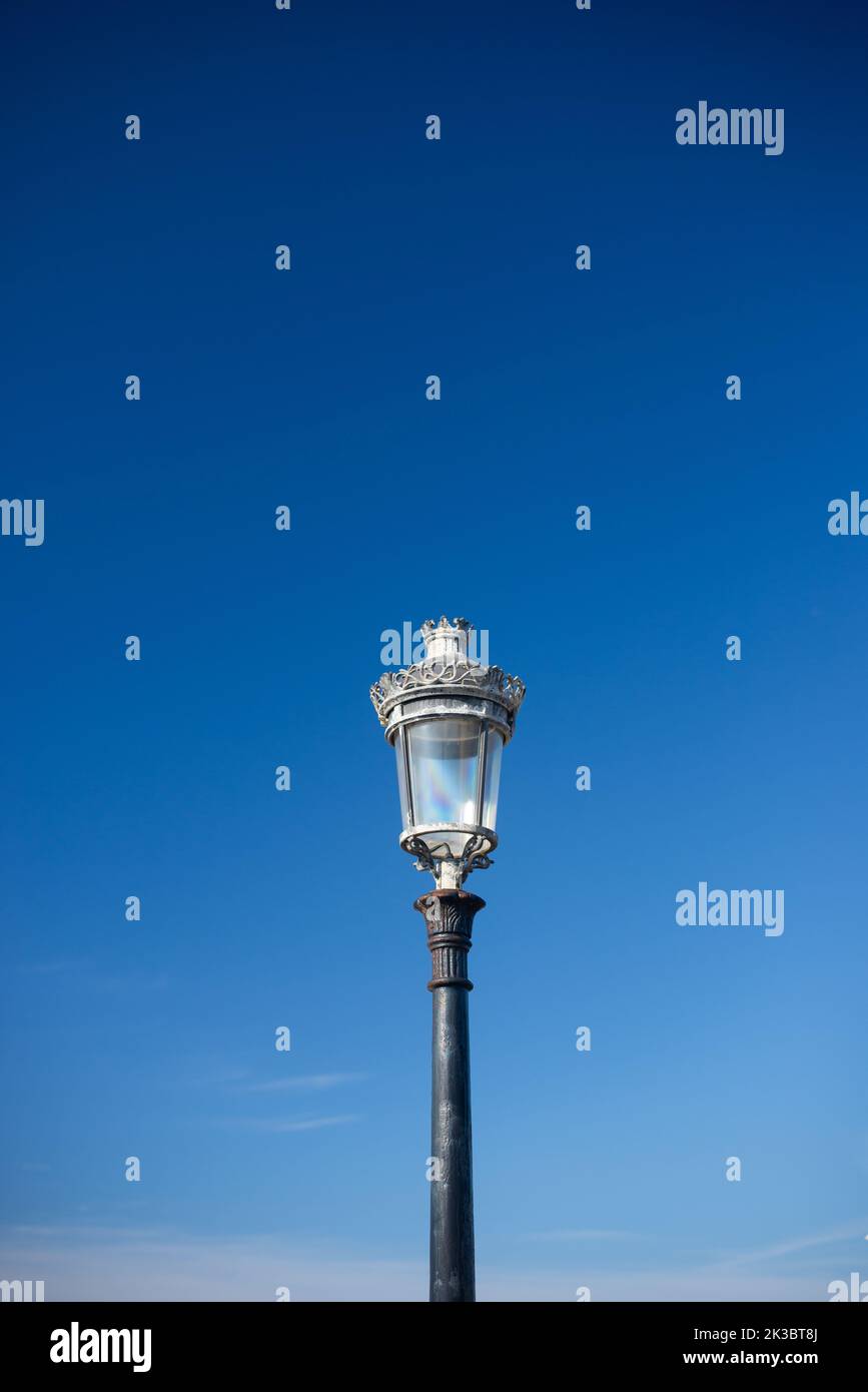 Victorian streetlight against plain sky Stock Photo