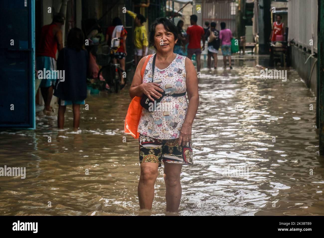 Marikina, Philippines. 26th Sep, 2022. Super typhoon victim walks on a flooded area to return on their properties after the raged of Noru. Super Typhoon Noru locally named as Karding battered in the landmass of Luzon island in the Philippines. Noru with the wind of 140 kilometers per hour near the center and gustiness of up to 170 km per hour forcing the evacuation of thousands of individuals specially in hardly hit and catch basin areas. Credit: SOPA Images Limited/Alamy Live News Stock Photo