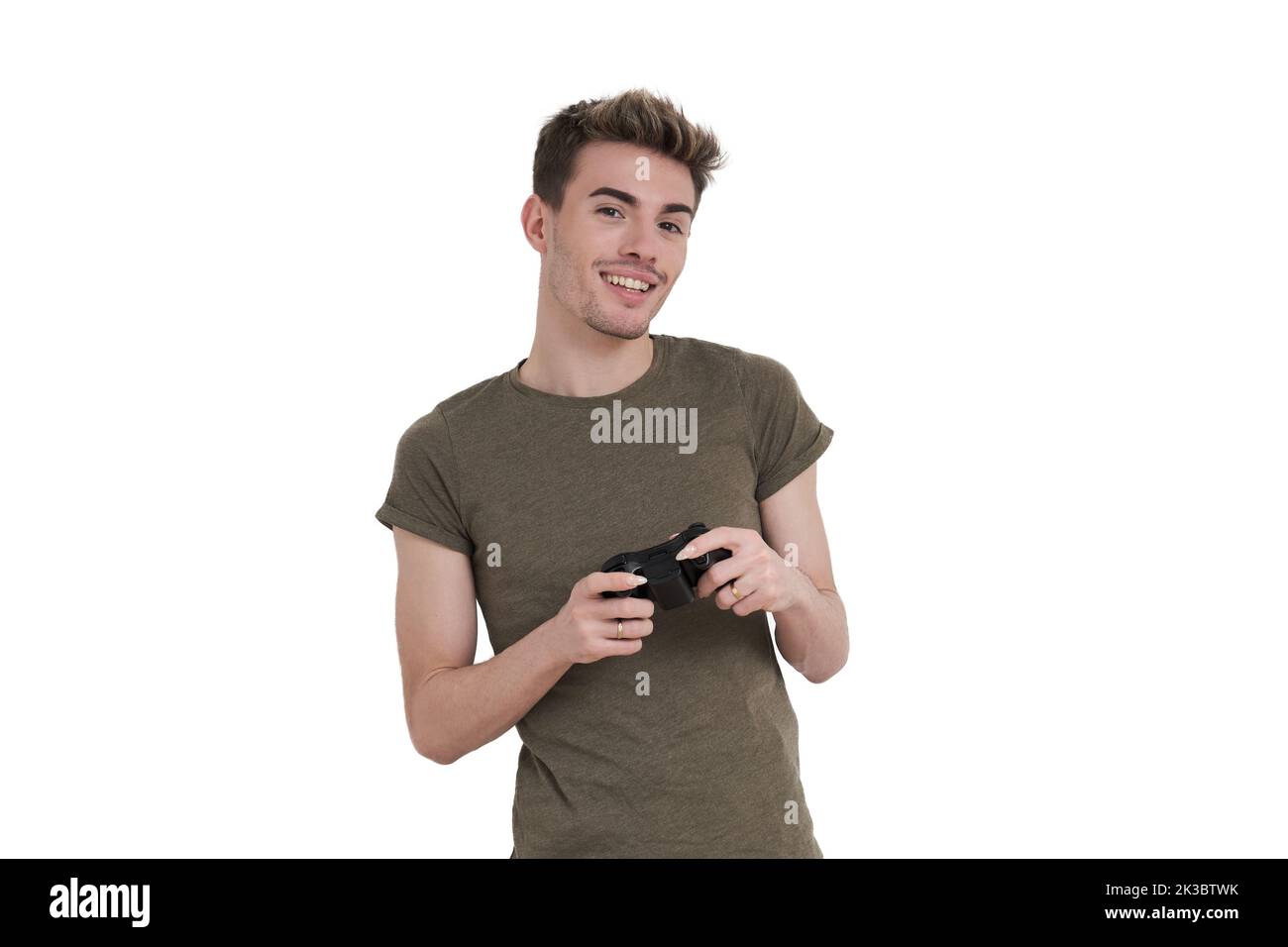 Young caucasian man smiling with a joystick, isolated. Stock Photo