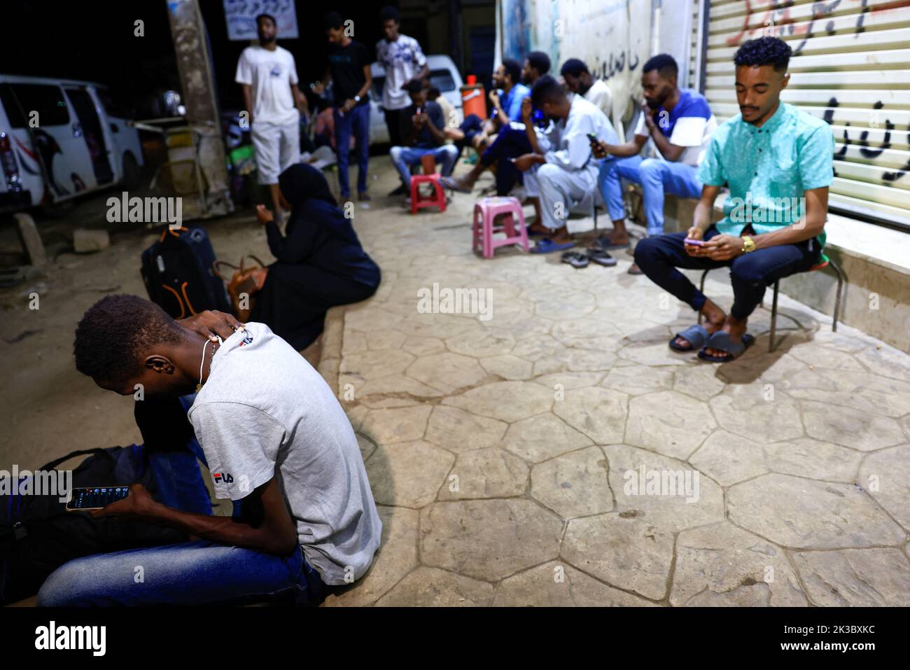 People wait for the a before leaving to Egypt in Khartoum, Sudan September 24, 2022. REUTERS/Mohamed Nureldin Abdallah Stock Photo