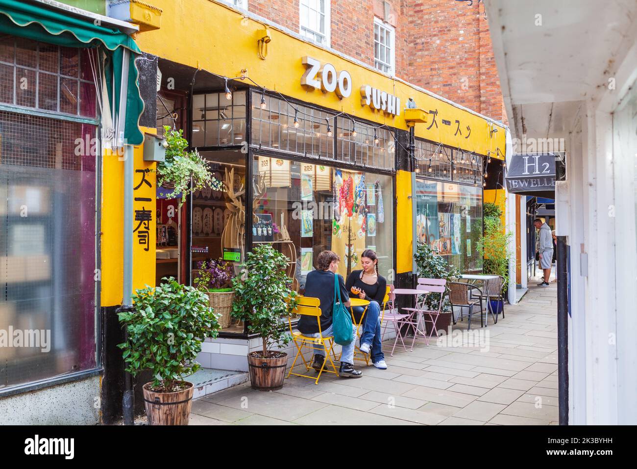 People dining outdoors at the Zoo Sushi Japanese Restaurant at Stratford upon Avon Stock Photo