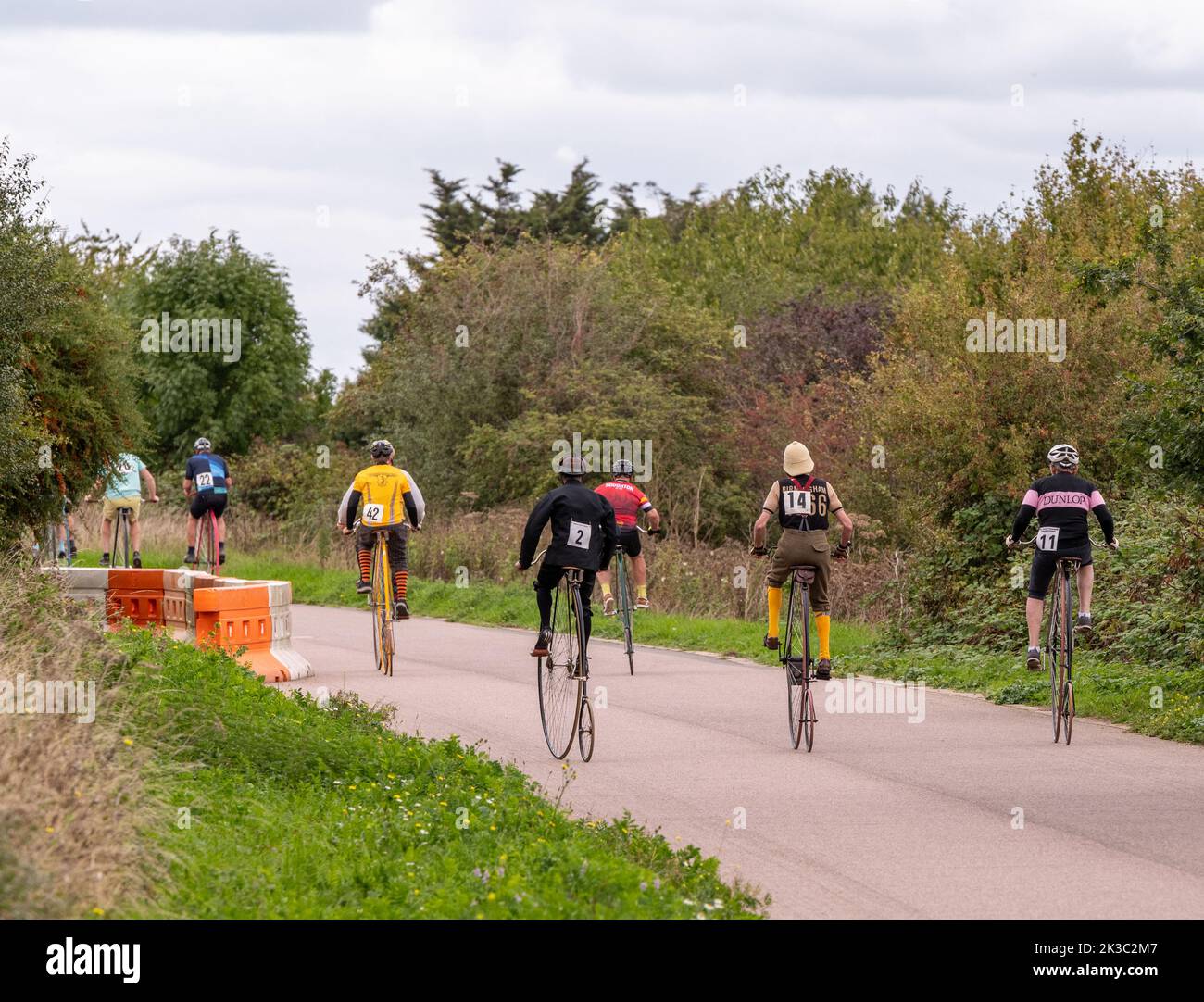 People racing penny farthings in national cycle race hires stock