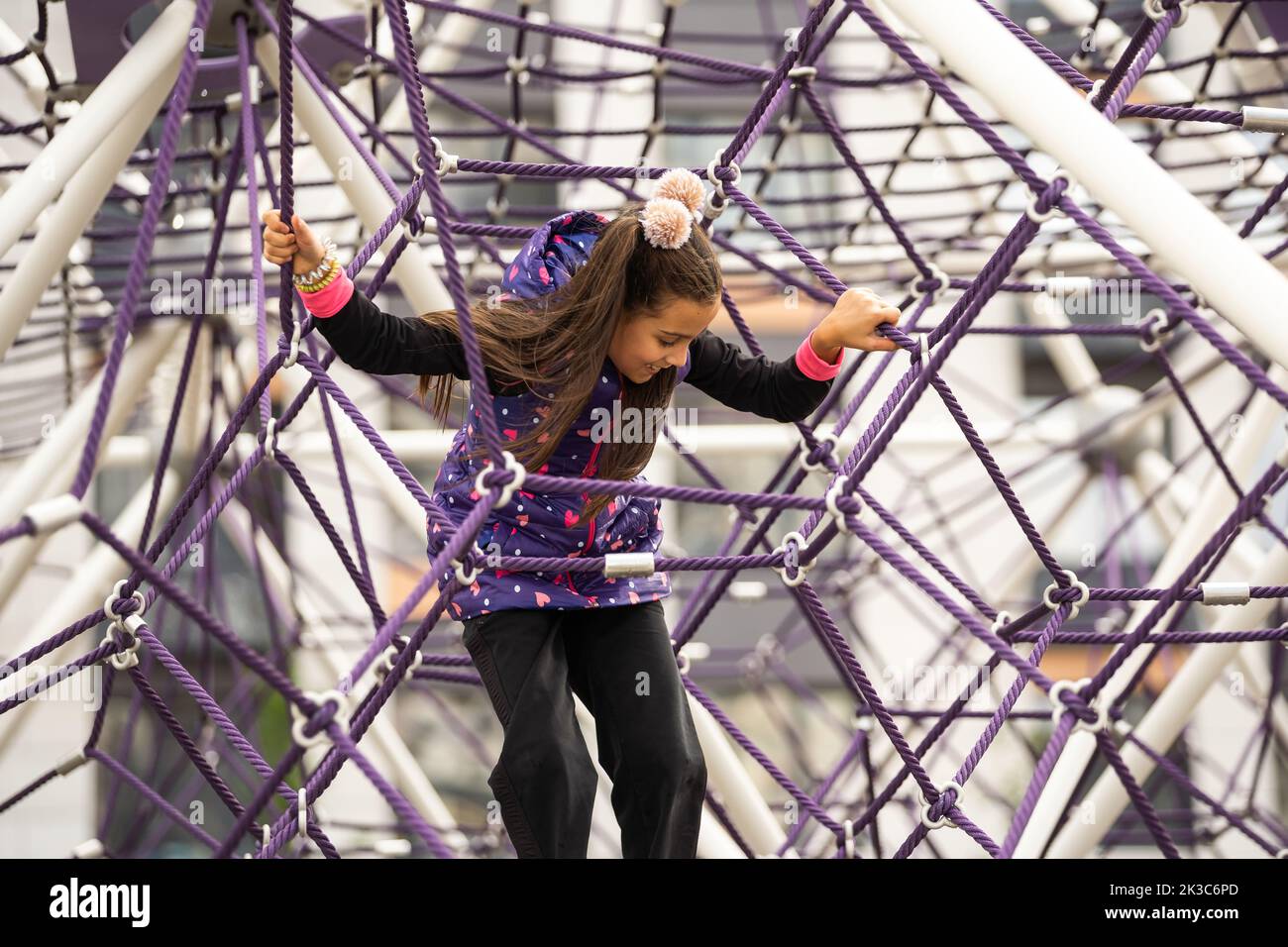 Cute teenage girl in the rope labyrinth kid park attraction Stock Photo ...
