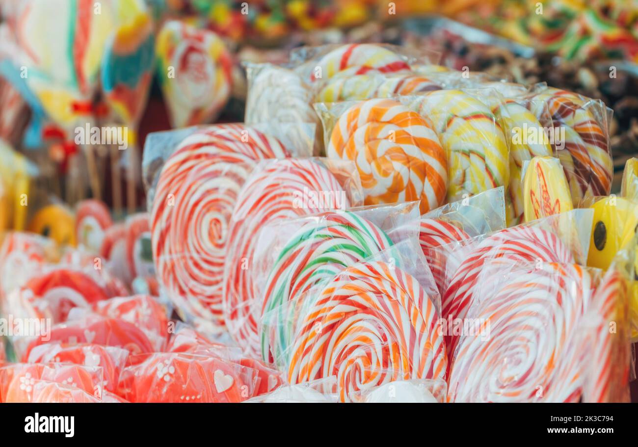 Various colorful candy sweets on traditional festival street market, selective focus Stock Photo