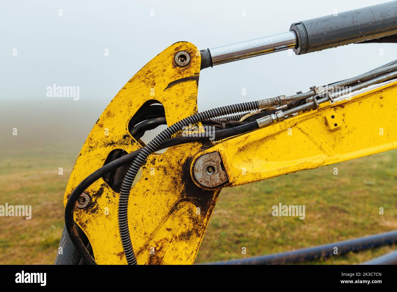 Excavator boom arm with hydraulic cylinder stick, selective focus Stock Photo