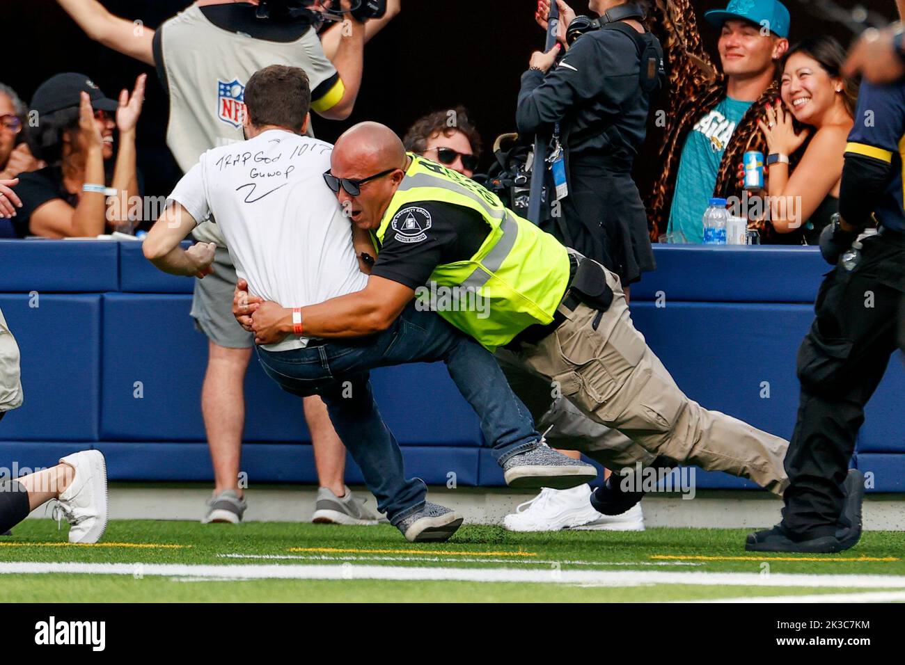 Los Angeles, United States. 25th Sep, 2022. A man is held down by security after he ran on the field in a timeout during the NFL football game between Los Angeles Chargers and Jacksonville Jaguars at SoFi Stadium. Final score; Chargers 10:38 Jaguars. Credit: SOPA Images Limited/Alamy Live News Stock Photo