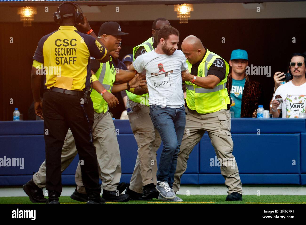 Los Angeles, United States. 25th Sep, 2022. A man is escorted by security after he ran on the field in a timeout during the NFL football game between Los Angeles Chargers and Jacksonville Jaguars at SoFi Stadium. Final score; Chargers 10:38 Jaguars. Credit: SOPA Images Limited/Alamy Live News Stock Photo