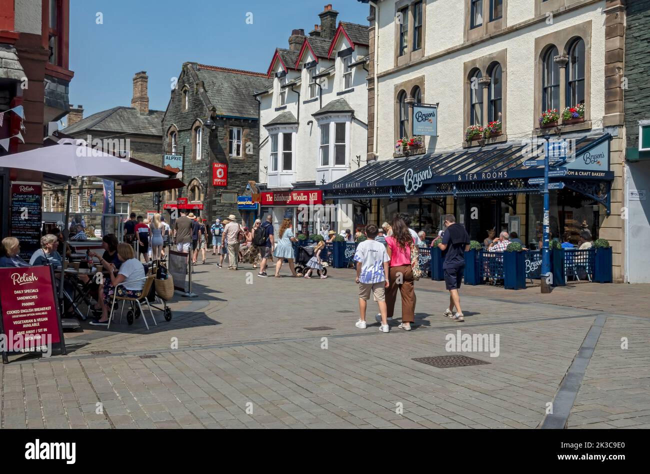 People tourists visitors walking in the town centre shops outdoor