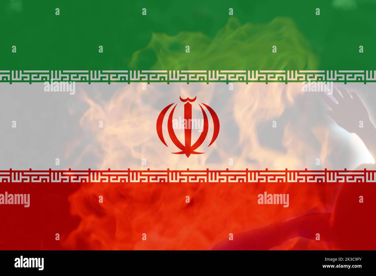 Defocus protest in Iran. Conflict war over border. Country flag. Woman low rights. Male hands. Iranian women. Violence Iran. Fire, flame. Out of focus Stock Photo