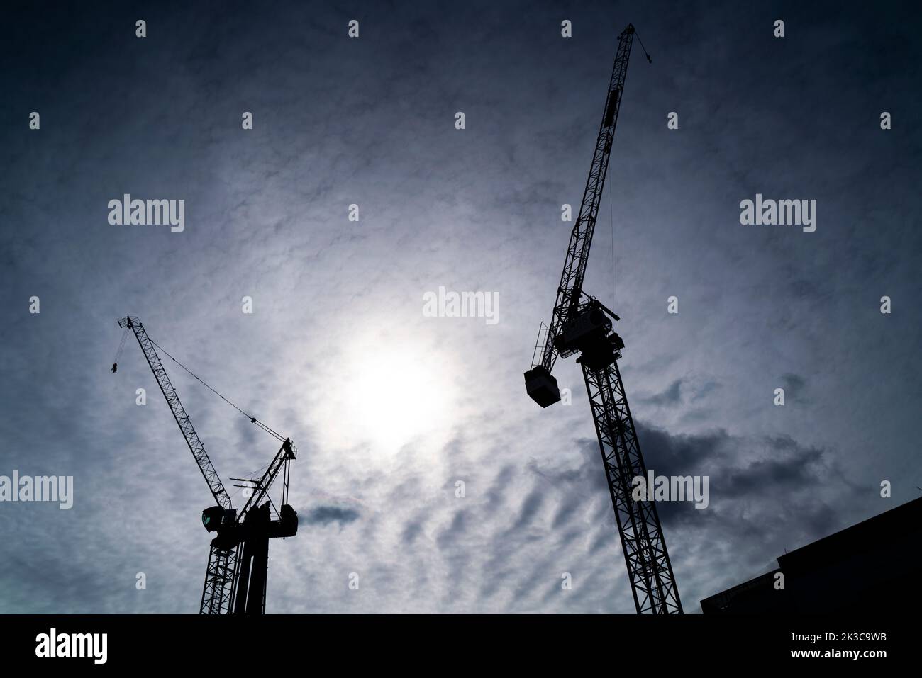 Silhouette of cranes on a construction site in the Temple Quarter area of Bristol, England, UK. Stock Photo