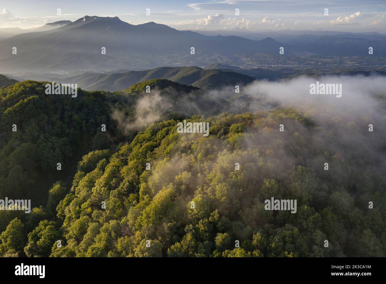 Aerial view of Montnegre mountain at sunset. In the background, the Montseny massif (Vallès Oriental, Barcelona, Catalonia, Spain) Stock Photo