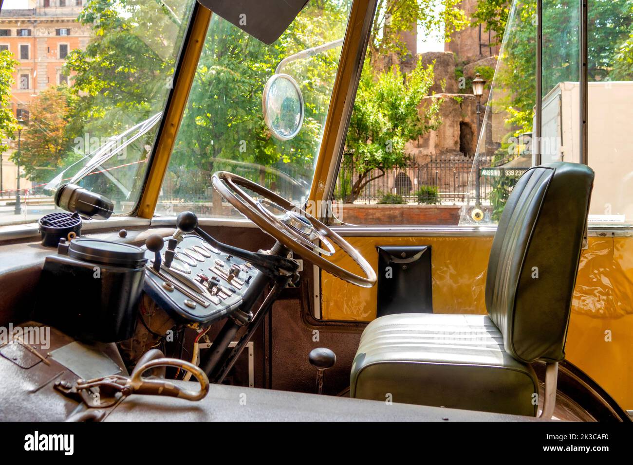 Driving seat of a Fiat 2472 Viberti CGE trolleybus in Piazza Vittorio, Rome, Italy Stock Photo
