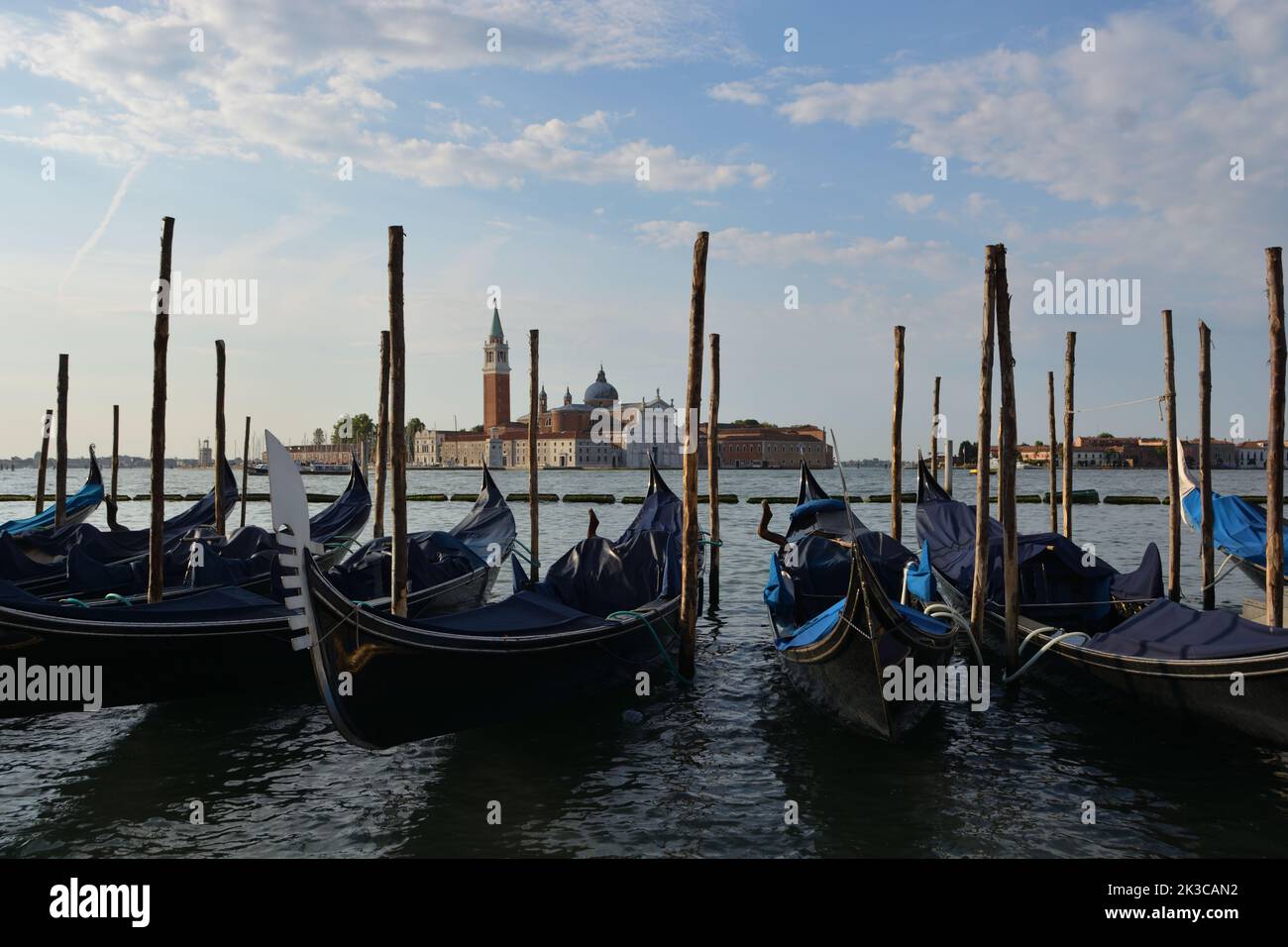 Gondolas in lagoon of Venice on sunrise, Italy Stock Photo - Alamy