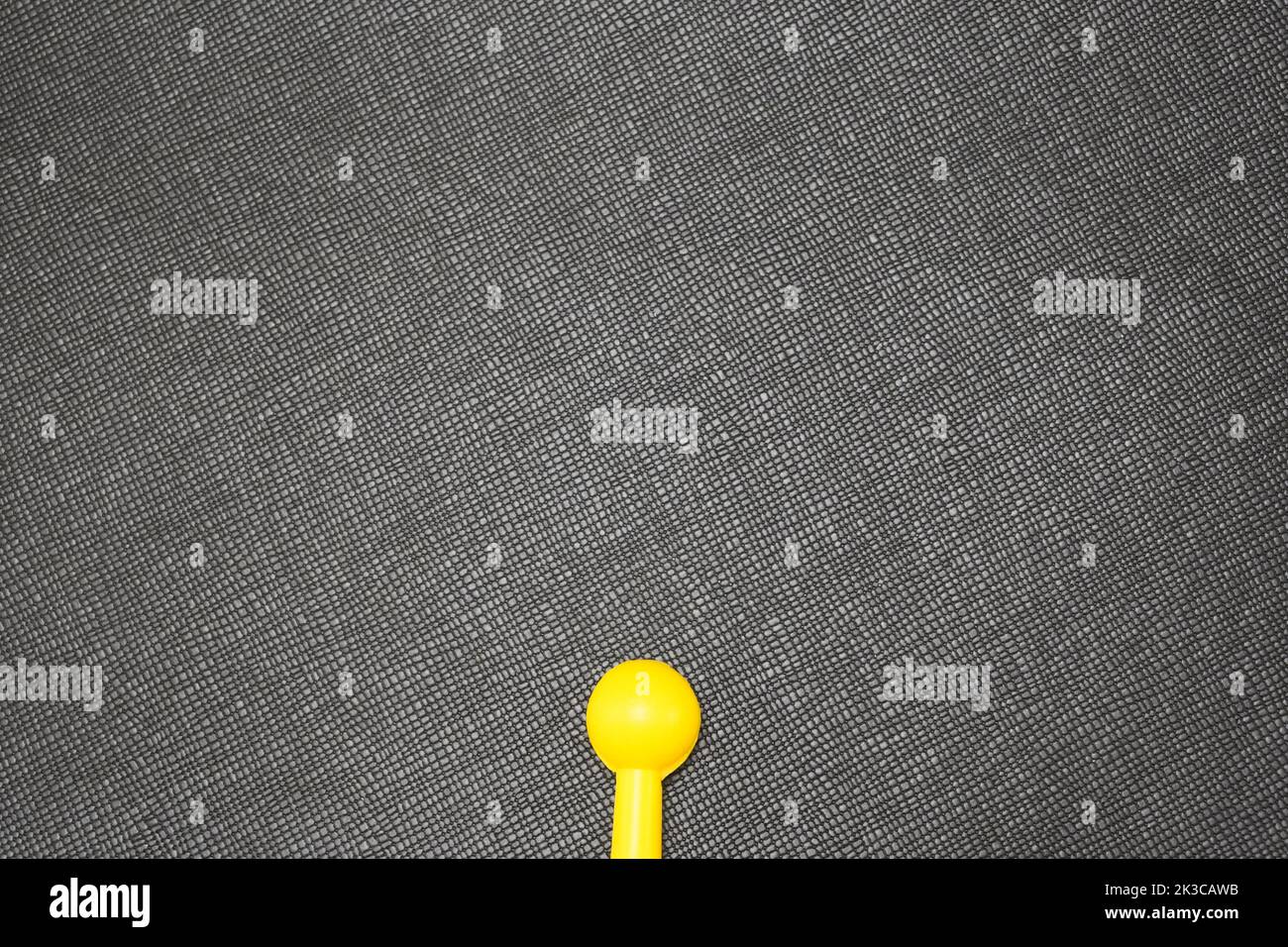 Creative insemination concept, yellow toy sticks representing sperm swim towards target Stock Photo