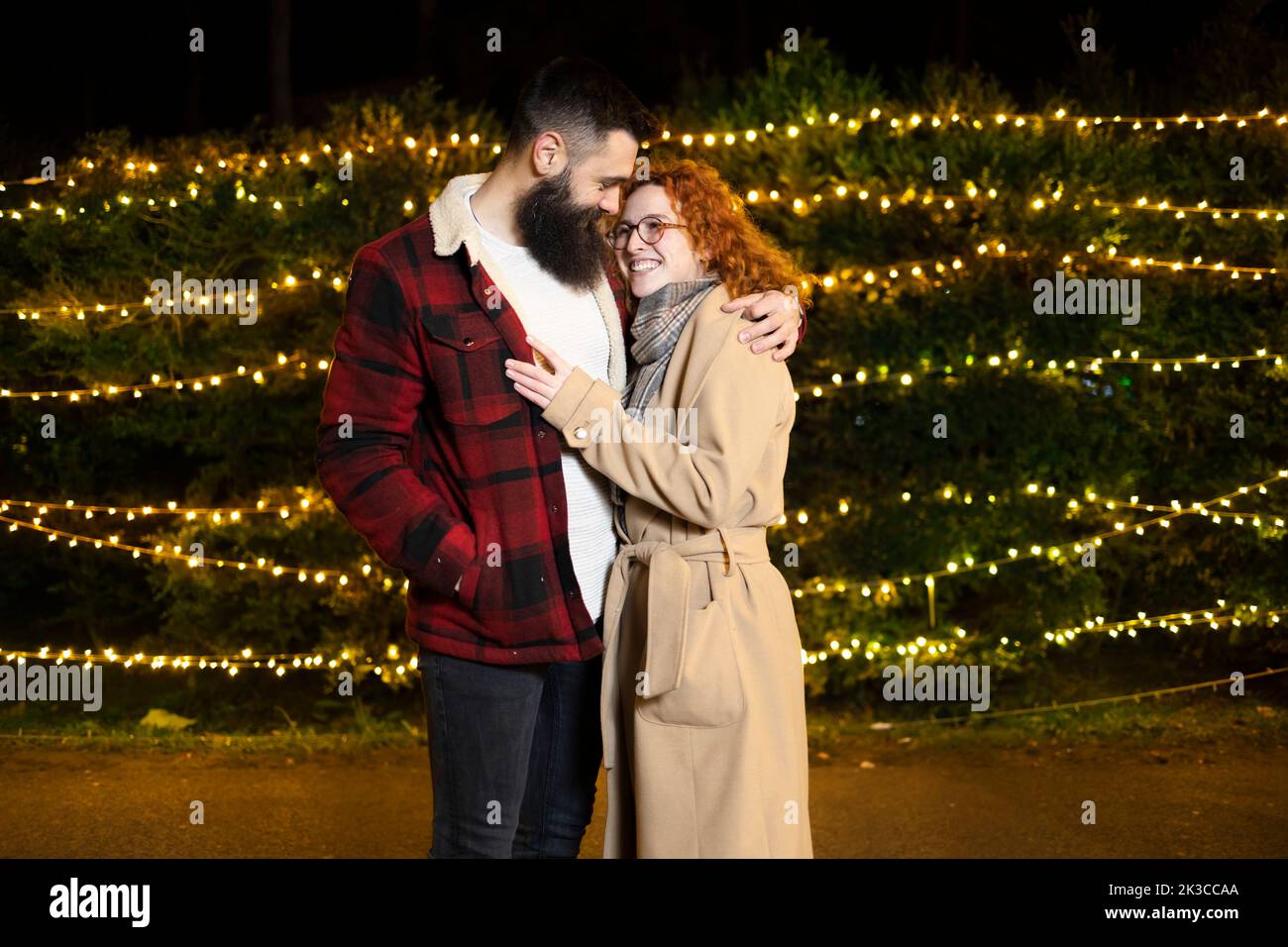 A man holding his female partner in arms during Christmas and winter time Stock Photo
