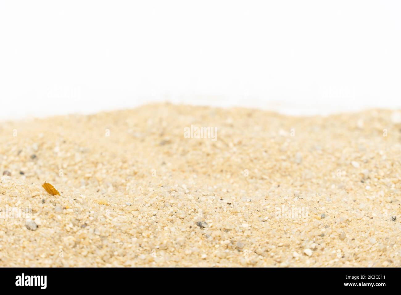 Sand texture in the summer sun. sand on white background. Stock Photo
