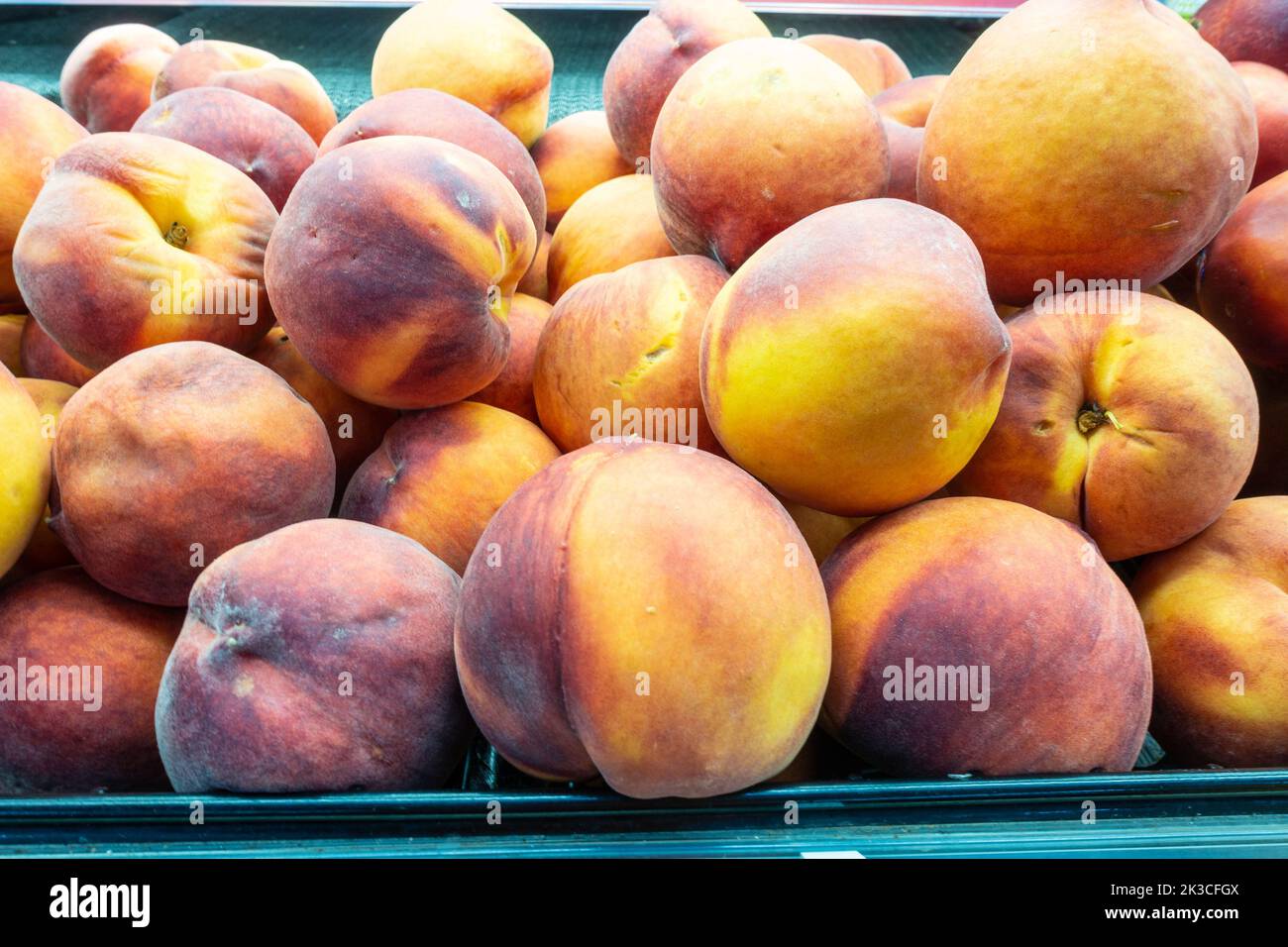 Fresh peaches on display in a supermarket Stock Photo Alamy