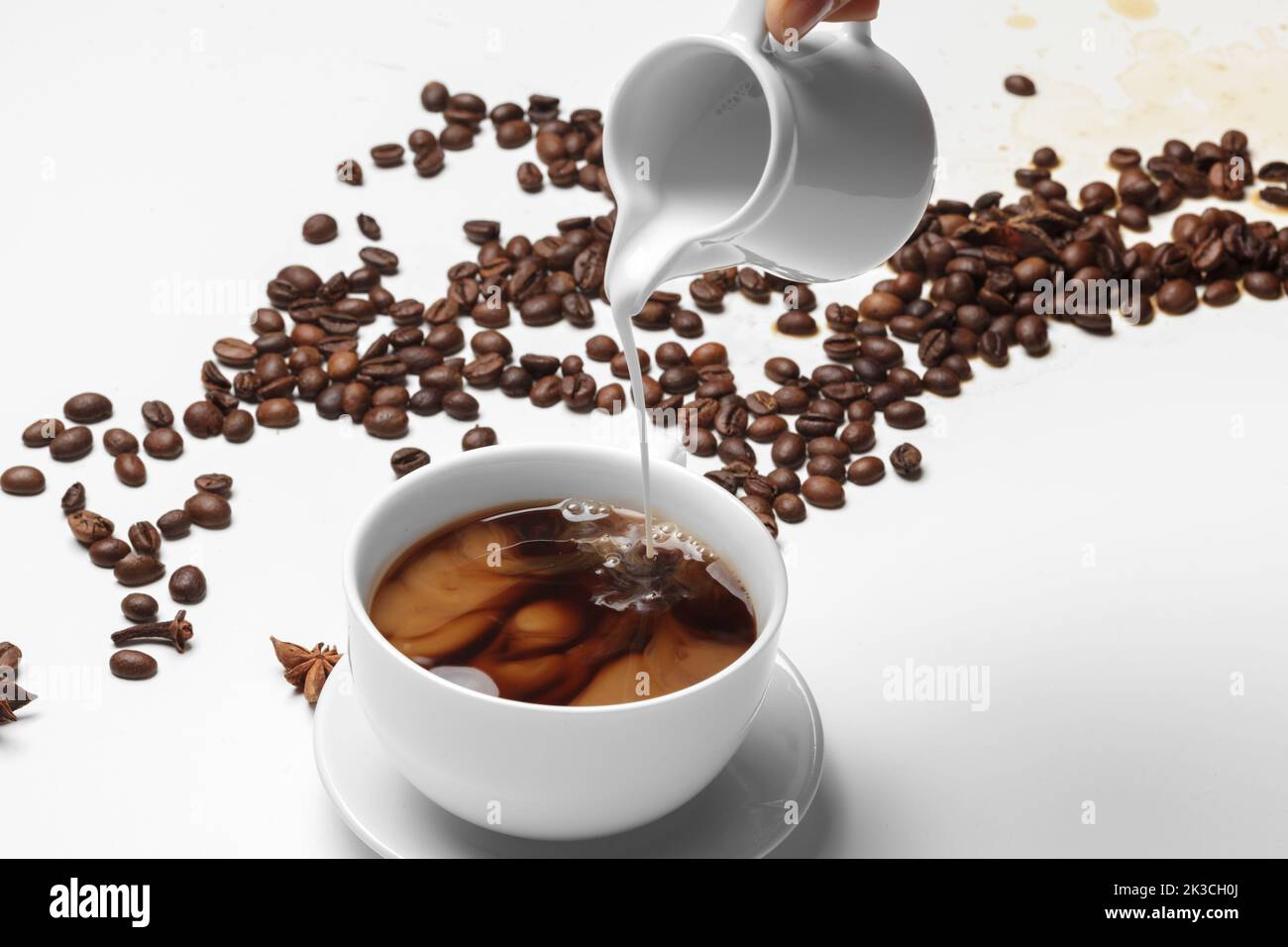 Coffee bean small cup full of coffee bean isolated on white Stock Photo