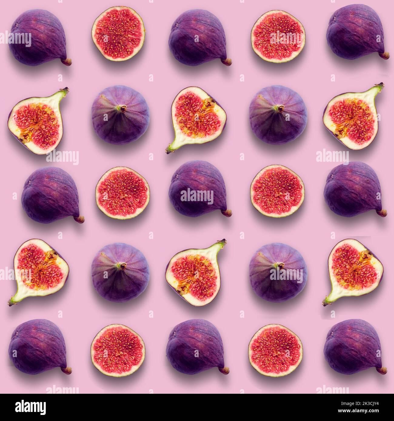 Fig fruits, whole and cut in half, seamless vibrant grid pattern on pink color background Stock Photo