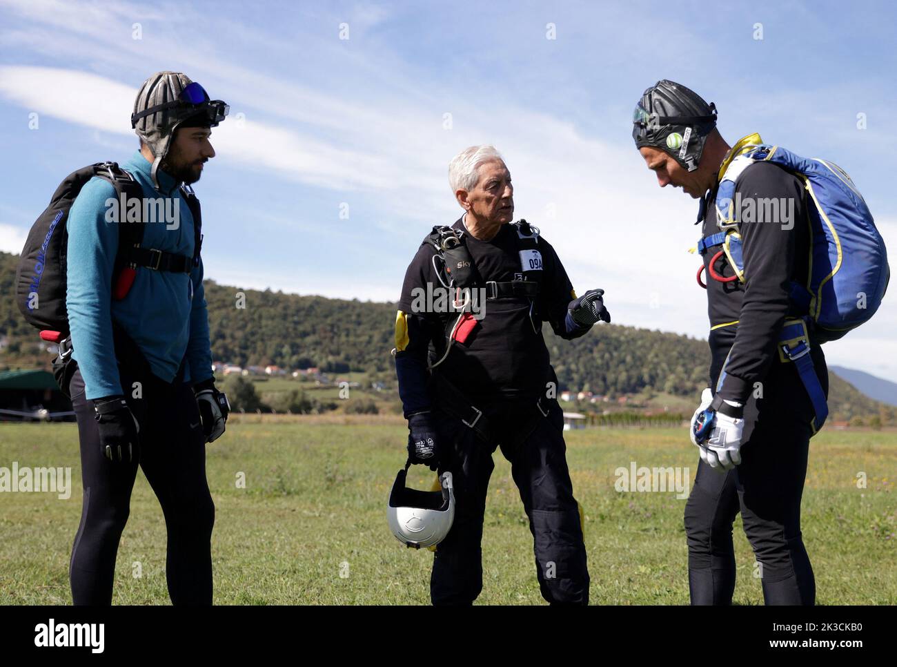 Ibrahim Kalesic, 88-year-old parachuter, speaks with friends before jumping during Para Challenge Cup in Bihac, Bosnia and Herzegovina September 24, 2022. REUTERS/Dado Ruvic Stock Photo
