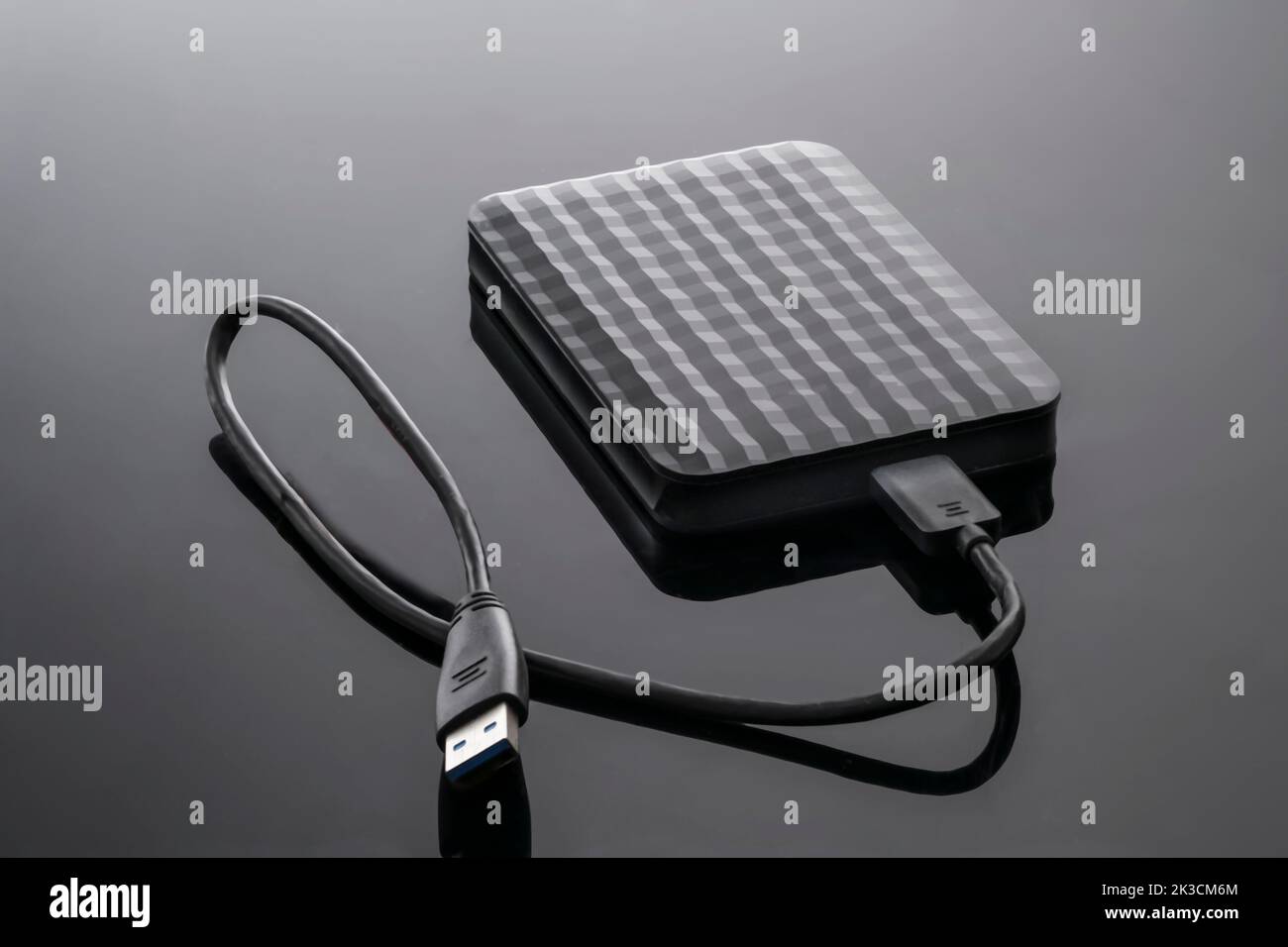 external hard disk drive memory for computer on a black background close-up. Stock Photo