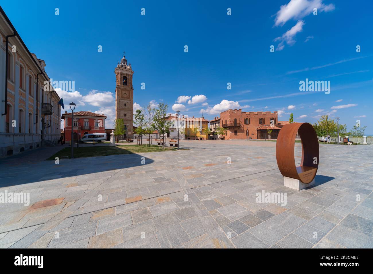 La Morra, Langhe, Piedmont, Italy: Castle square with the bell tower or civic tower (18th century) with clock and palazzi medioevali , blue sky with c Stock Photo