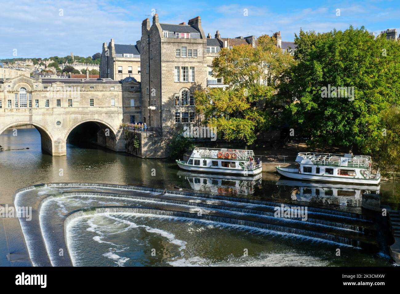 Tourist boats on the River Avon at Pulteney Weir in Bath. Stock Photo