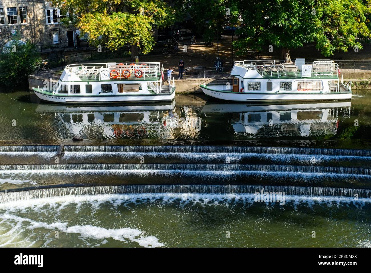 Tourist boats on the River Avon at Pulteney Weir in Bath. Stock Photo
