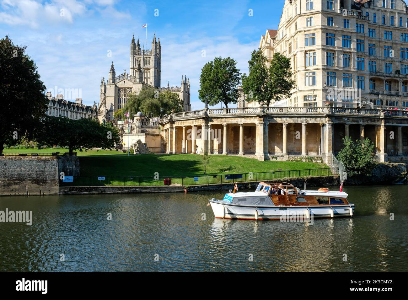 Bath Abbey and the Empire Hotel and Parade Gardens viewed across the River Avon on a bright autumn morning in 2022. Stock Photo