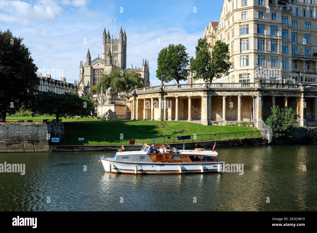 Bath Abbey and the Empire Hotel and Parade Gardens viewed across the River Avon on a bright autumn morning in 2022. Stock Photo