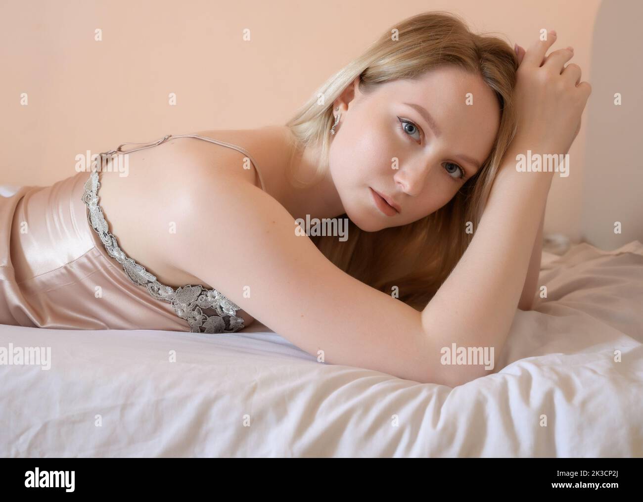 Portrait of a beautiful young woman with blue eyes. Stock Photo