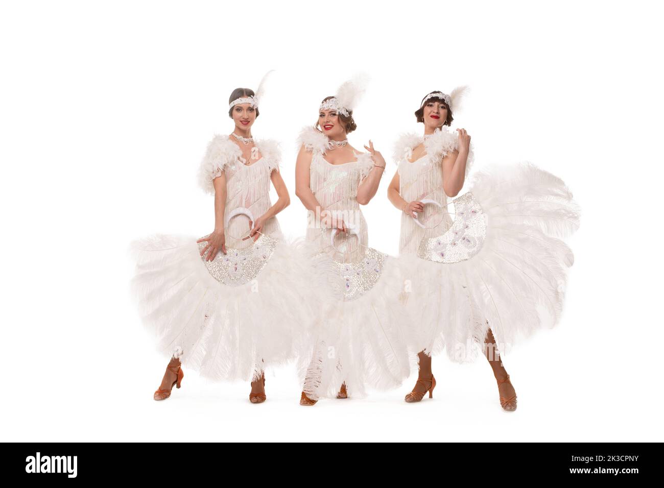 Glad women in burlesque dresses in studio Stock Photo