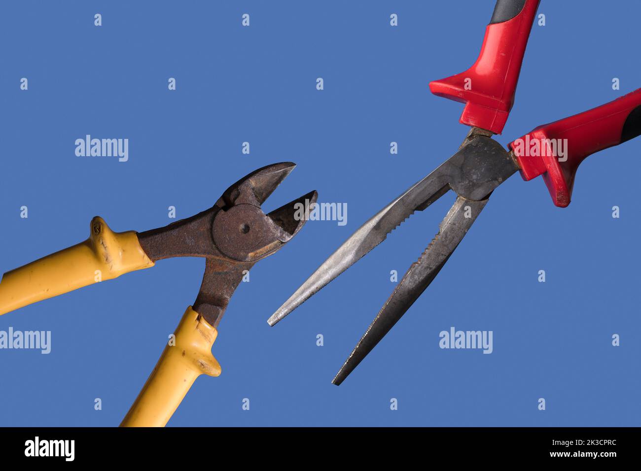 different cutting pliers, with blue background Stock Photo