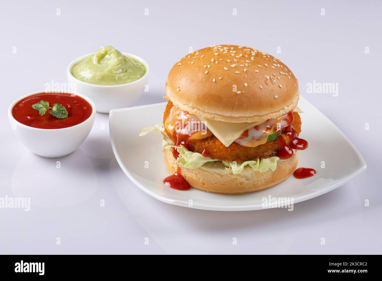 Fresh tasty burger isolated on white background. Stock Photo