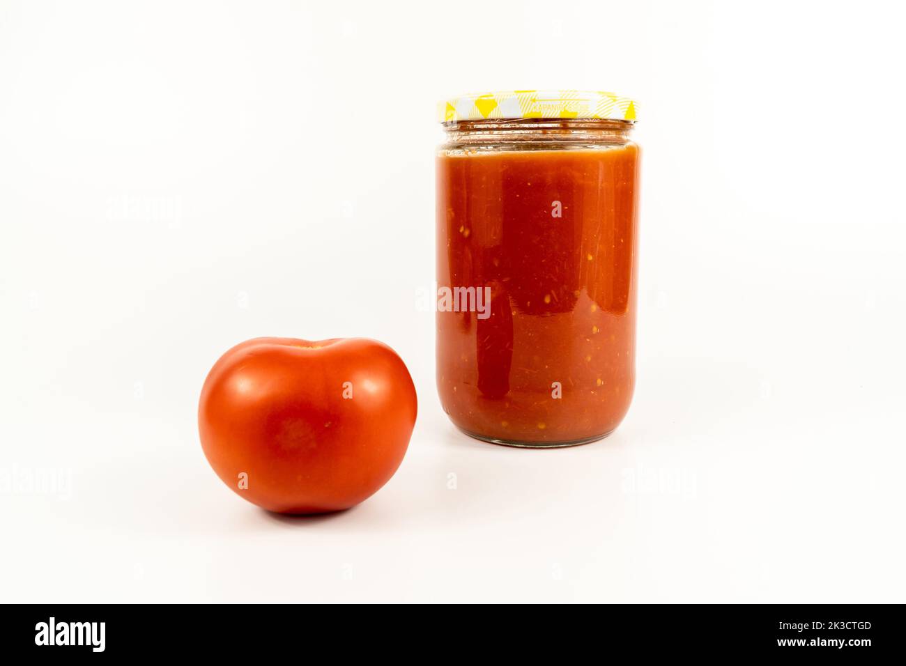 Tomato sauce in a jar. Homemade tomato sauce making process concept
