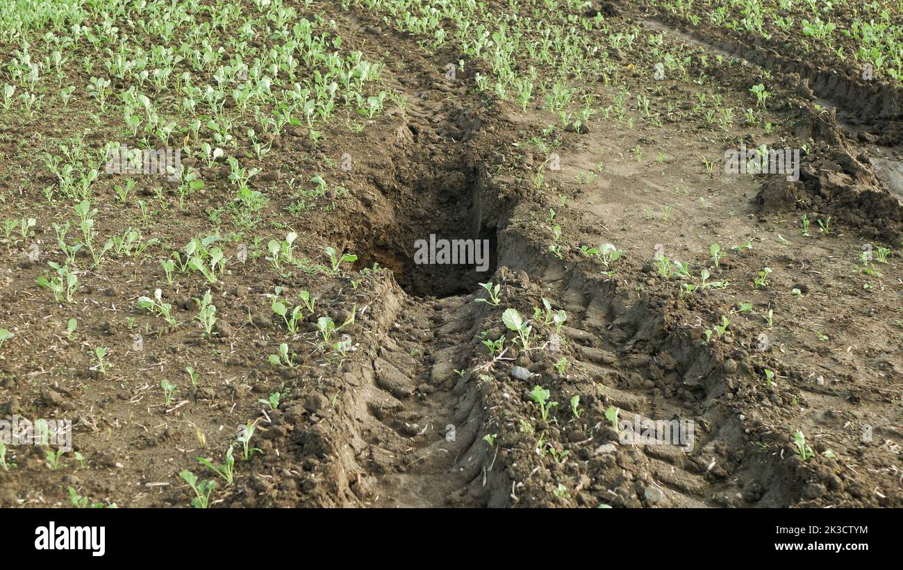 Fields erosion damage soil hole pit inappropriately managed soil earth land with degradation