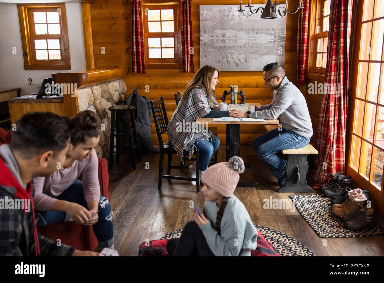 Family relaxing on vacation in cabin Stock Photo