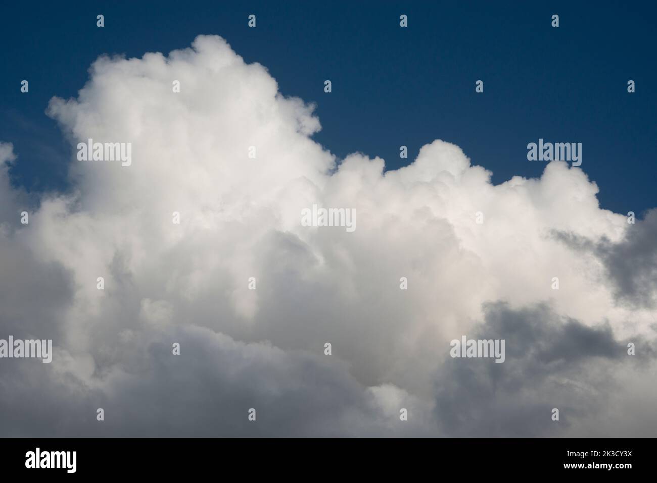 Large billowing white cloud against a blue sky Stock Photo